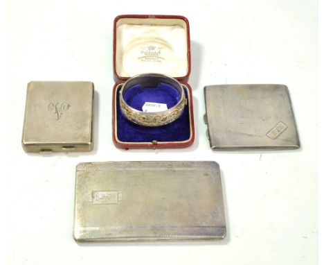 A hallmarked silver cigarette case of rounded rectangular form, a plated cigarette case, a hallmarked silver combination ciga