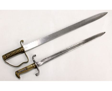 A military issue Wilkinson of London sawback bayonet, the blade with broad arrow and manufacturer's stamps to base, blade len
