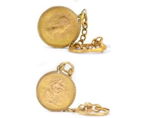 An Elizabeth II full sovereign, 1962, in 9ct yellow gold mount suspended on 9ct yellow gold short chain and keyring mount, ap