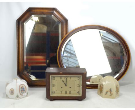 A mixed lot comprising a 1930s oak canted rectangular wall mirror, 73 x 46cm, an Edwardian inlaid oval example, also two glas
