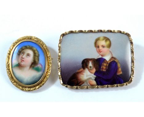 A Victorian yellow metal framed rounded rectangular brooch set with porcelain plaque painted with a boy with his dog, 5 x 3.5