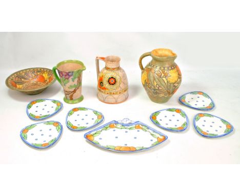 CHARLOTTE RHEAD; an 'Arabesque' jug and bowl for Wood's, two jugs for Crown Ducal and a set of six saucers/side plates and di