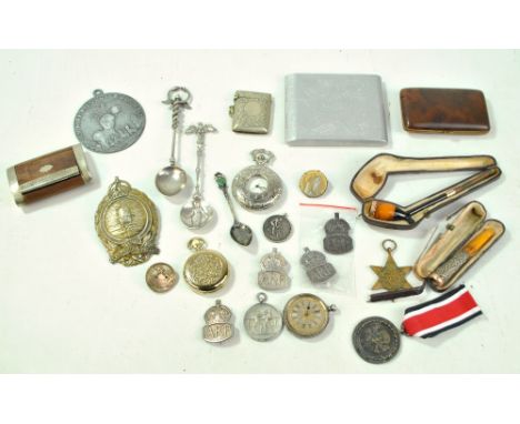 A mixed group of collectors' items including cased pipe and cigarette holder, silver plated vestas, snuff box, military badge