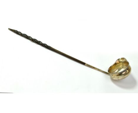 A 19th century white metal toddy ladle with single lipped bowl and baleen handle, apparently unmarked, length 34.5cm.Addition