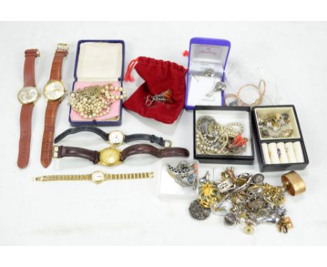 A quantity of costume jewellery including ear studs, pendants, ring, brooches, also wristwatches, etc.