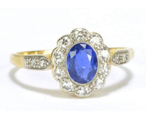 An&nbsp;Art Deco 18ct yellow gold, sapphire and diamond ring, the central cornflower blue sapphire within a border of diamond