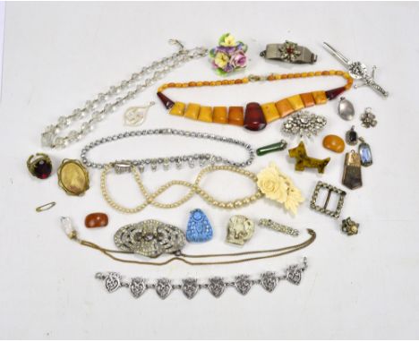 A small group of costume jewellery to include a bead work necklace, a clear cut glass example, a 9ct yellow gold framed hard 