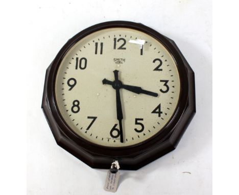 SMITHS; a 1940s Sectric brown bakelite electric wall clock with dodecagonal case, width 40cm.