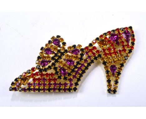 ESCADA; a vintage high heeled shoe shaped brooch paved with pink, red, orange and black glass faceted stones, width 10cm, mar