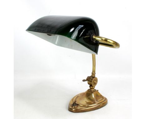 A 20th century brass library table lamp with green glass shade, height 36cm.