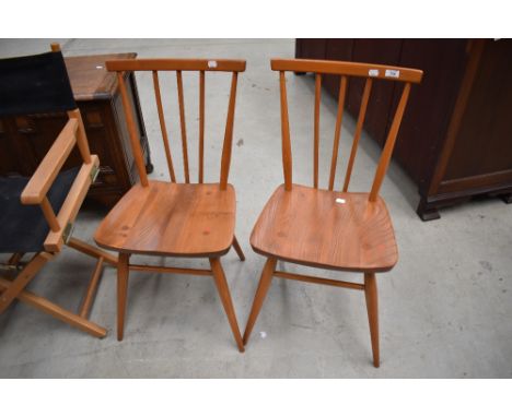 A pair of Ercol style spindle back dining chairs
