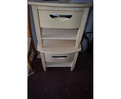 A pair of modern light laminate bedside tables with single drawer and undershelf