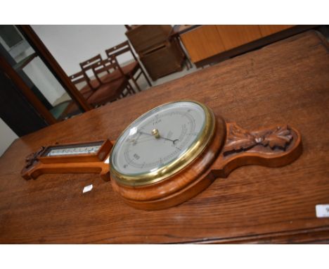A modern mahogany banjo style barometer