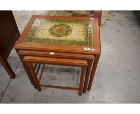A vintage nest of three tile top occasional tables