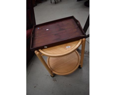 A modern light wood tea trolley and mahogany tray