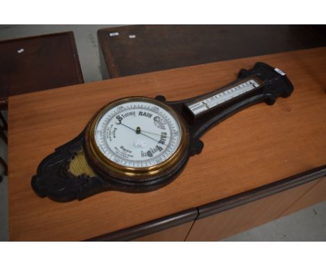 An early 20th Century barometer having brass presentation plaque for Bro H Bakes of the Endeavour Lodge (NIOOF)