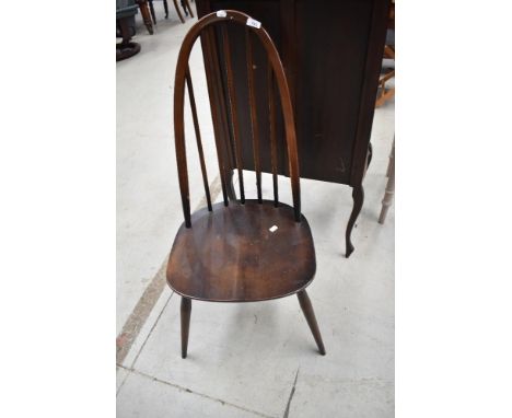 A dark stained Ercol high back dining chair