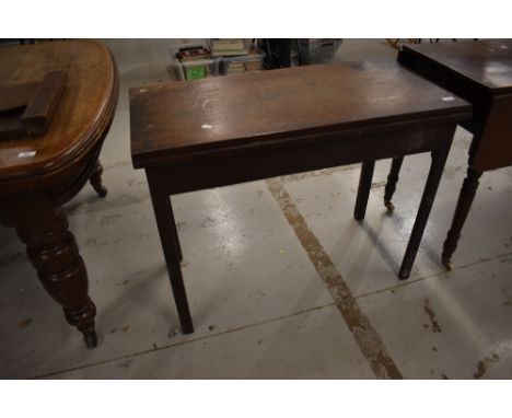 A Victorian oak gate leg table with fold out top