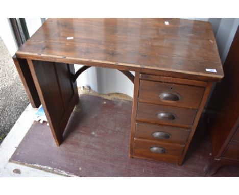 A vintage stained frame tailors/seamstress table having measure marks, drop flap and slide over four side drawers, width appr