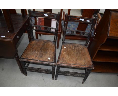 An interesting pair of Victorian bedroom chairs having bobbin frames and ply seats