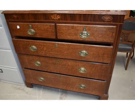 A 19th Century oak chest of two over three drawers having brass handles and bracket feet