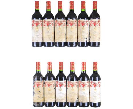 1995 Chateau Mouton Rothschild Premier Cru Classe, Pauillac  12x75cl   Labels damp-soiled, damaged and torn, 1 peeling, all w