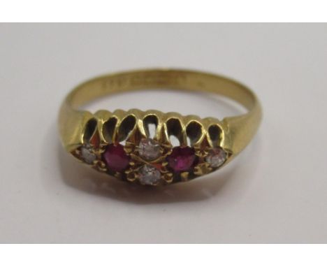 18ct yellow gold six stone diamond and ruby ring, stamped 18, size O, 3.56g