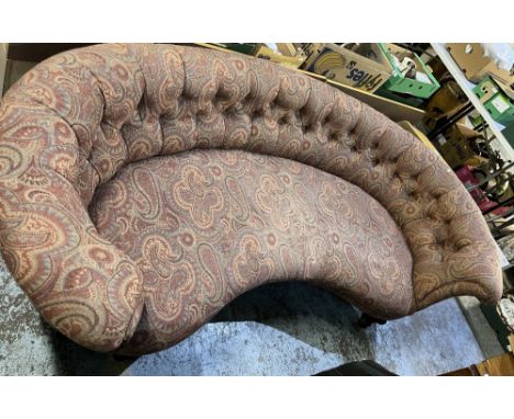 Victorian curved button back sofa, upholstered in red paisley pattern fabric on fluted rosewood legs with brass sockets and c