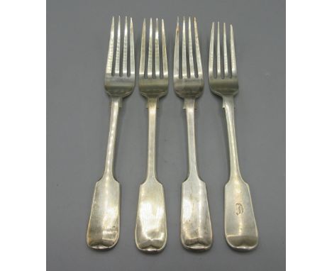 Three late Victorian silver forks in fiddle pattern with hanover finials by Charles Boyton III, London 1900, and a early Vict