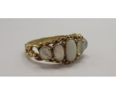Victorian 15ct yellow gold five stone opal ring on ornate band, stamped 15, size P, 2.37g