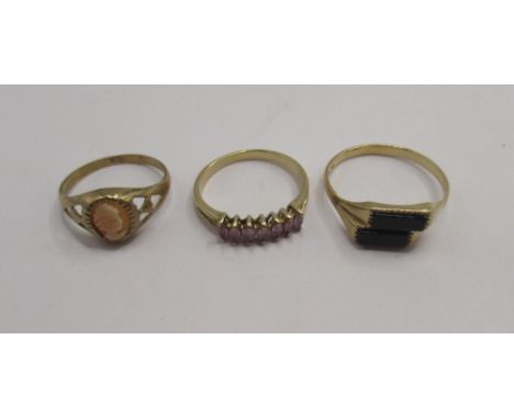 9ct yellow gold ring set with cameo, size M1/2, a 9ct ring set with black stones, size R, and a 9ct yellow gold ring with pur