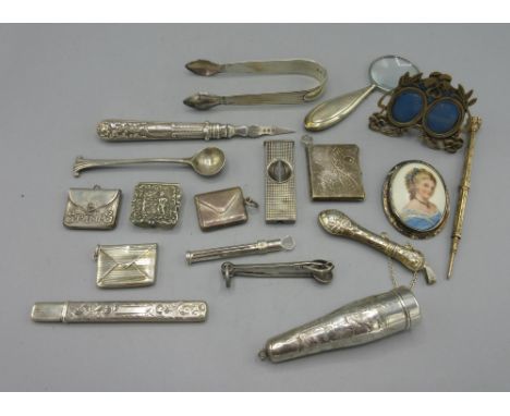 Silver cheroot holder with engraved foliate decoration, three silver stamp cases stamped 925, silver cigar tools, miniature s