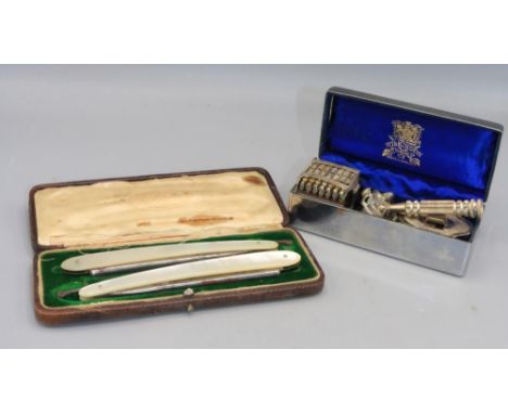 Pair of M. Kindal mother of pearl straight razors and Wilkinson Sword seven day razor set in metal case