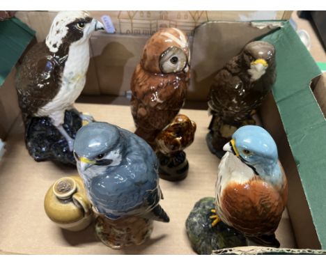 Five Royal Doulton Whyte &amp; Mackay Scotch Whisky decanters in the form of various birds of prey, and a smaller Beswick exa