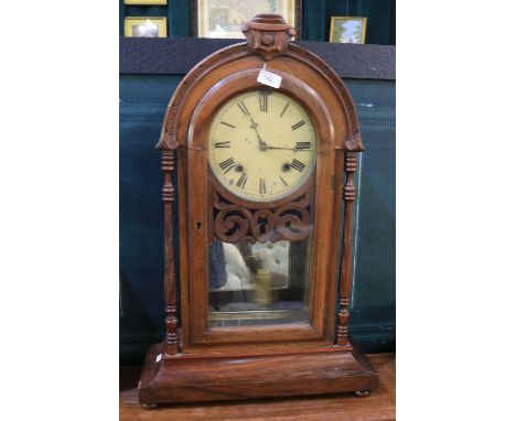 19th Century American 8 day walnut shelf clock, carved case decorated turned carved pilasters, arched glazed panel door enclo