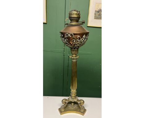 Substantial 19th century brass column oil lamp base, the triform base with claw feet, copper reservoir, H71cm