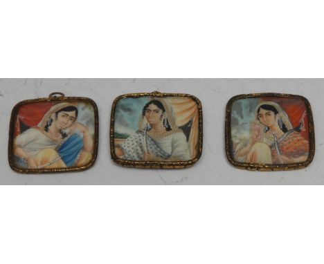 Indian School (19th century), a set of three portrait miniatures, of ladies of the court, head-and-shoulder length, each wear