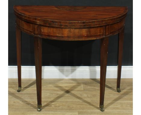 A George III mahogany demilune card table, hinged crossbanded top enclosing a baize lined playing surface, tapered square leg