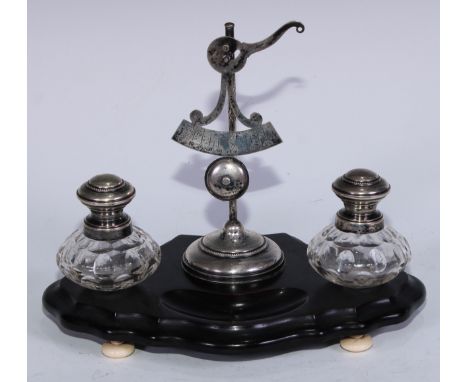 A 19th century Dutch silver and ebonised inkwell, central letter scale flanked by a pair of cut glass well and pounce pot, sh