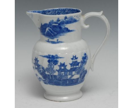 A  Caughley/Coalport moulded jug,  printed with chinoiserie landscapes in underglaze blue, 15.5cm high, c.179090 