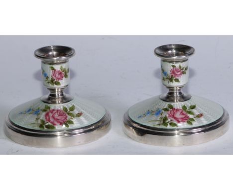 A pair of Elizabeth II silver and guilloche enamel candlesticks, bell shaped sconces, domed circular bases, 8cm high, Adie Br