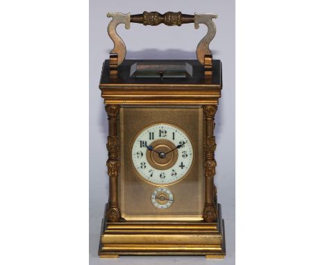 A large late 19th century French repeater carriage clock, the 5.5cm ivorine dial above subsidiary alarm dial, 8 day movement 