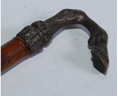 A 19th century novelty walking stick, the silver plated handle as a deer's hoof and fetlock, the cane 85.5cm long overall 