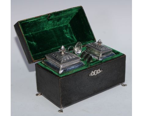 A George II silver tea caddy and sugar box, each with batwing-fluted domed cover, gadrooned borders, shell aprons and scroll 