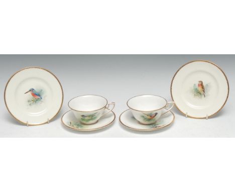 A pair of Royal Worcester teacups, saucers and side plates,  painted by D Jones, signed,  with naturalistic birds, printed ma