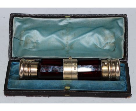 A Victorian silver-gilt mounted ruby glass combination double scent bottle and vinaigrette, hinged and screw-fitting covers, 