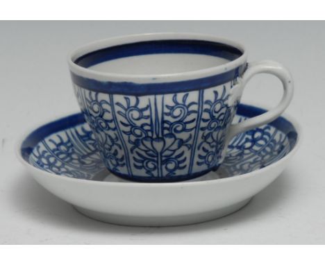 A Worcester Barr period Royal Lily pattern  ogee shaped teacup and saucer, with entwined handle, c.1815 