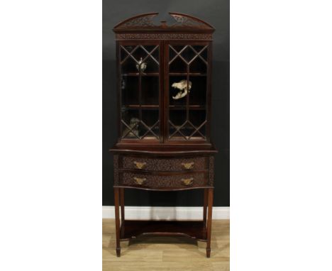 A Chippendale Revival mahogany display cabinet, broken-arch pediment above a pair of astragal glazed doors, the projecting se