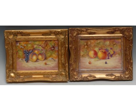 A pair of English porcelain rectangular plaques, painted by  Ernest R. Booth, signed, with ripe fruit on a mossy ground, 18cm