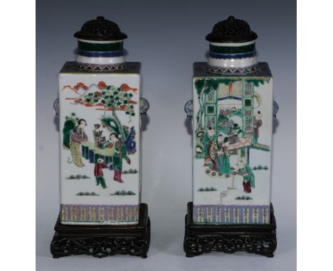 A pair of Chinese square vases, painted in polychrome in the famille verte and rose palette with figures of the court and mon